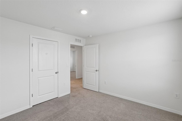 7530 Broad Pointe Dr, Zephyrhills, FL 33540 - unfurnished bedroom with light colored carpet