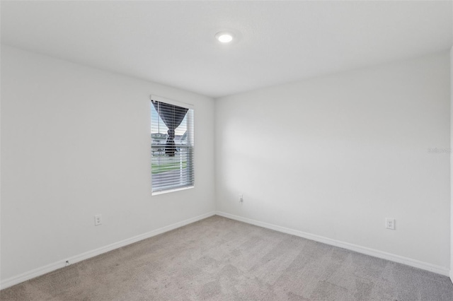 7530 Broad Pointe Dr, Zephyrhills, FL 33540 - empty room with light carpet and baseboards