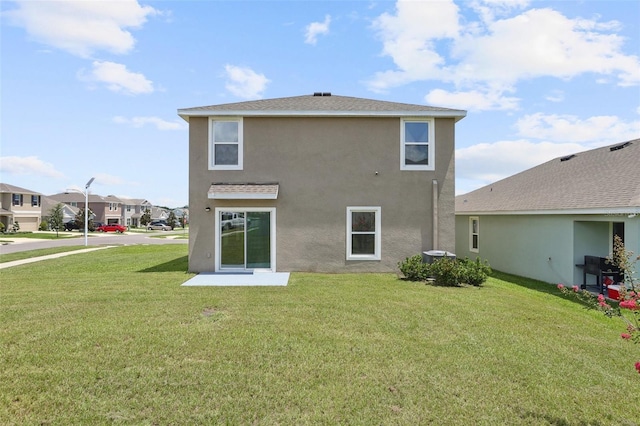 7530 Broad Pointe Dr, Zephyrhills, FL 33540 - back of property with a yard, stucco siding, and a residential view