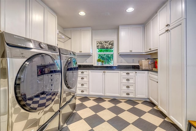 laundry area with recessed lighting, cabinet space, washer and dryer, and light floors