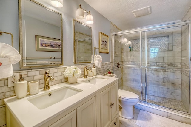 full bathroom with a sink, tile walls, and a shower stall