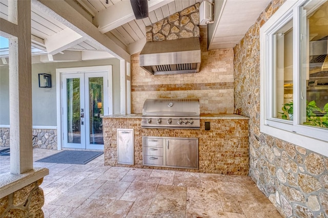 view of patio featuring french doors, exterior kitchen, and grilling area