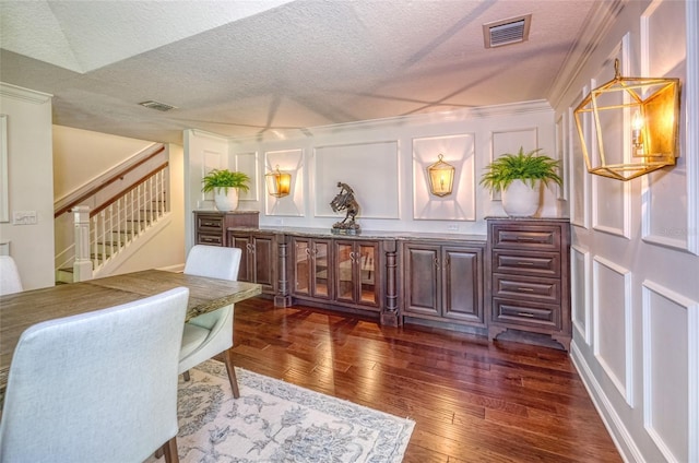 898 Cypress Lakeview Ct, Tarpon Springs, FL 34688 - office area featuring a decorative wall, a textured ceiling, dark wood-style floors, and ornamental molding