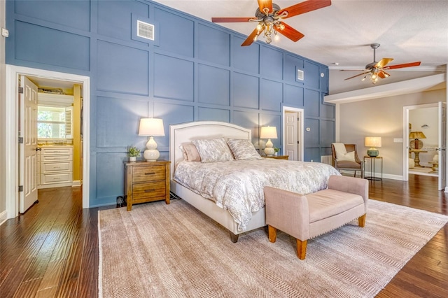 898 Cypress Lakeview Ct, Tarpon Springs, FL 34688 - bedroom with a decorative wall, wood finished floors, baseboards, and a ceiling fan