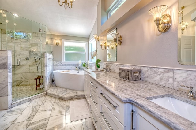 898 Cypress Lakeview Ct, Tarpon Springs, FL 34688 - full bath with plenty of natural light, a stall shower, marble look tile flooring, a freestanding bath, and tile walls