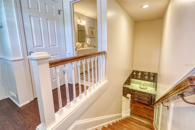 898 Cypress Lakeview Ct, Tarpon Springs, FL 34688 - stairs featuring wood finished floors, baseboards, and recessed lighting