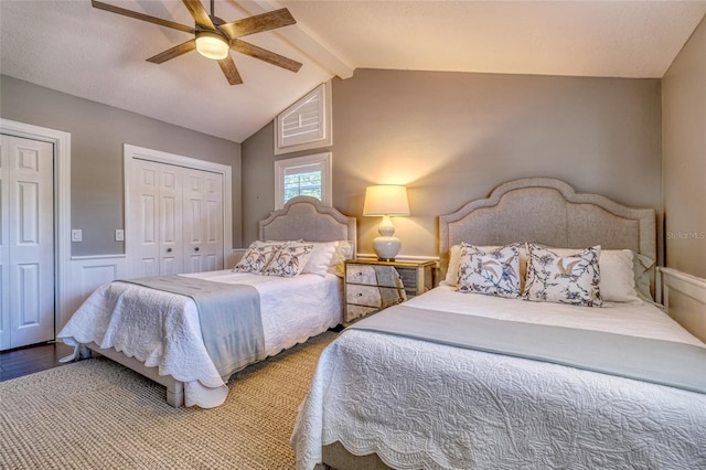 898 Cypress Lakeview Ct, Tarpon Springs, FL 34688 - bedroom with two closets, a ceiling fan, a wainscoted wall, and wood finished floors