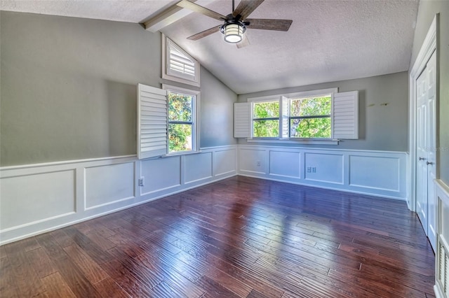 898 Cypress Lakeview Ct, Tarpon Springs, FL 34688 - spare room with a decorative wall, ceiling fan, wood-type flooring, a wainscoted wall, and a textured ceiling