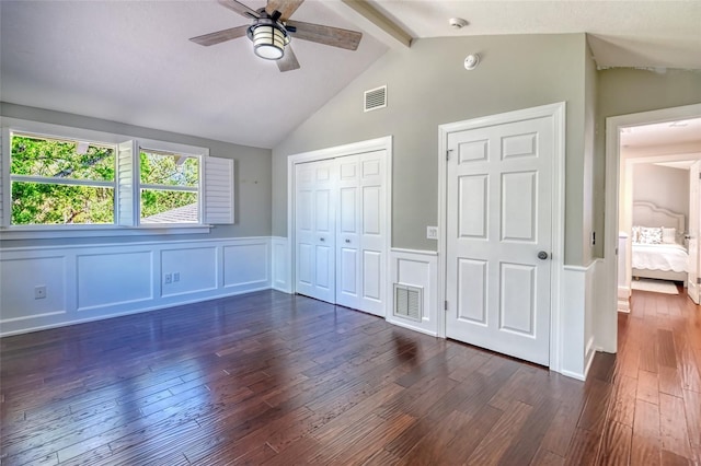 898 Cypress Lakeview Ct, Tarpon Springs, FL 34688 - unfurnished bedroom featuring dark wood-style flooring, wainscoting, a closet, a decorative wall, and ceiling fan