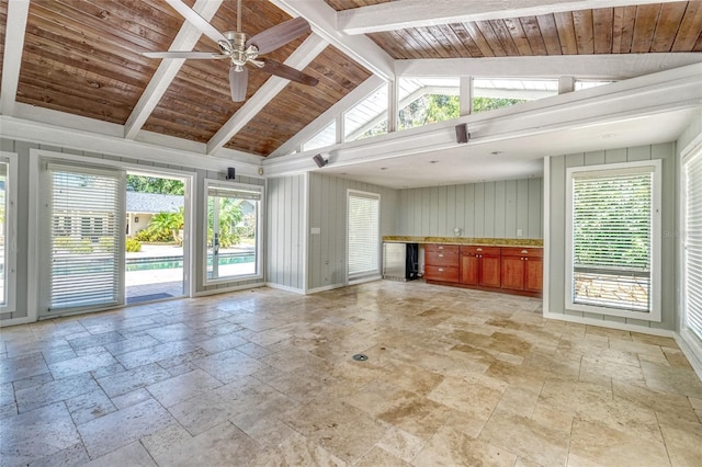 898 Cypress Lakeview Ct, Tarpon Springs, FL 34688 - unfurnished living room featuring stone tile flooring, ceiling fan, and wood ceiling