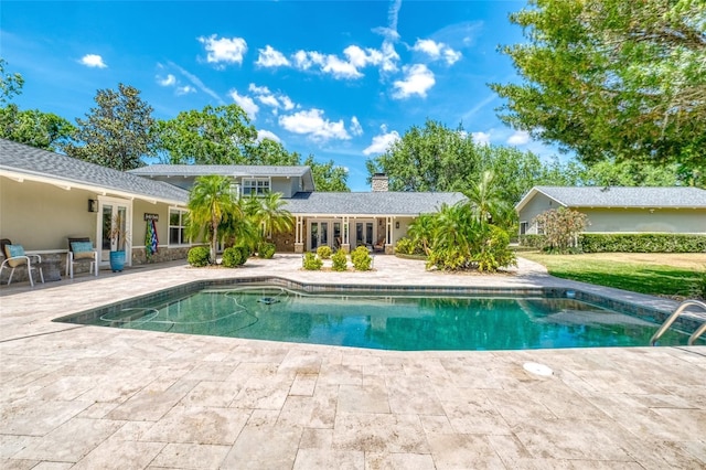 898 Cypress Lakeview Ct, Tarpon Springs, FL 34688 - swimming pool with a patio area and french doors