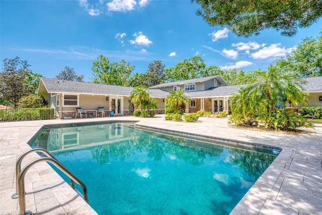 898 Cypress Lakeview Ct, Tarpon Springs, FL 34688 - outdoor pool featuring a patio area and french doors