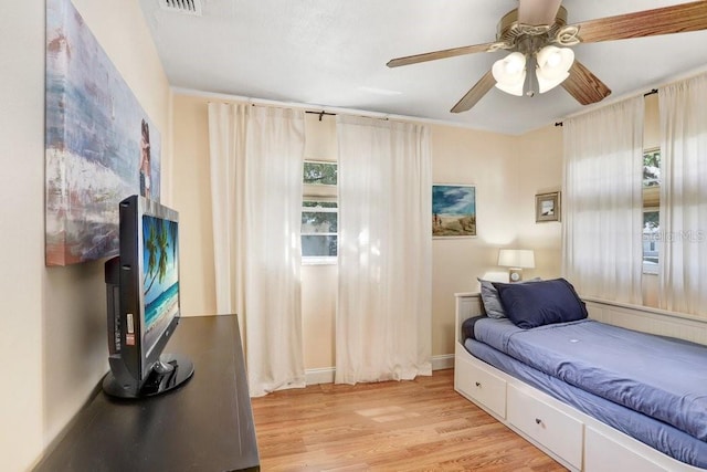 3214 W Rogers Ave, Tampa, FL 33611 - bedroom featuring light wood-style floors and a ceiling fan