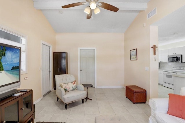 3214 W Rogers Ave, Tampa, FL 33611 - living area with high vaulted ceiling, ceiling fan, beam ceiling, light tile patterned flooring, and baseboards