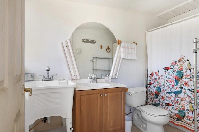3214 W Rogers Ave, Tampa, FL 33611 - bathroom featuring vanity, toilet, and curtained shower