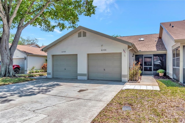8206 Leafy Ct, Port Richey, FL 34668 - view of front of property featuring stucco siding, concrete driveway, an attached garage, and roof with shingles