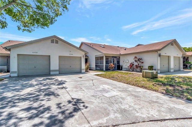8206 Leafy Ct, Port Richey, FL 34668 - single story home with stucco siding, a garage, and a sunroom