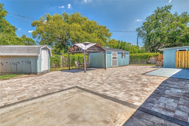 3045 Stratford Dr, Largo, FL 33771 - view of patio with fence, an outbuilding, and a storage shed