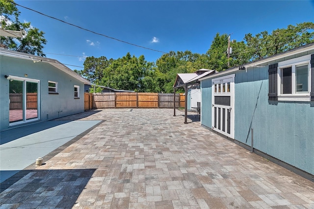 3045 Stratford Dr, Largo, FL 33771 - view of patio / terrace with a fenced backyard, an outbuilding, and a storage shed