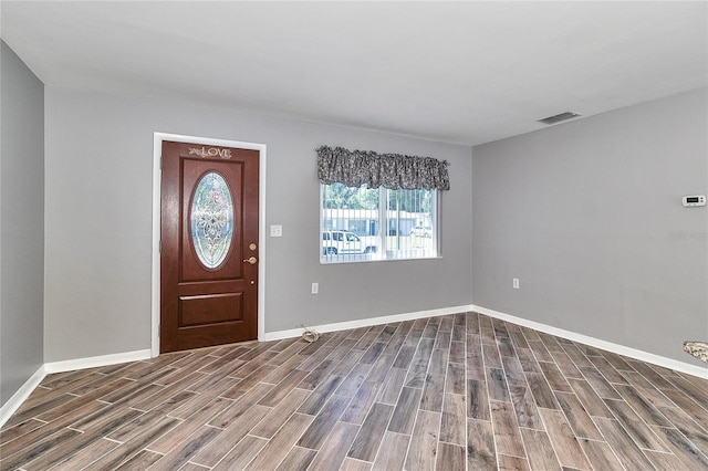 3045 Stratford Dr, Largo, FL 33771 - foyer with wood finished floors, visible vents, and baseboards