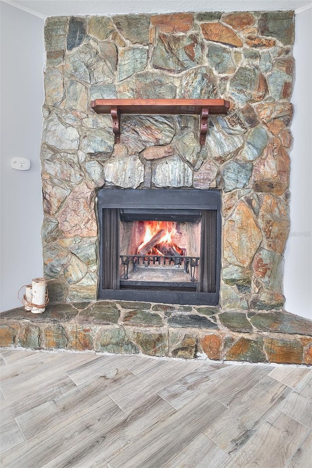 3045 Stratford Dr, Largo, FL 33771 - details featuring wood finished floors, a fireplace, and ornamental molding