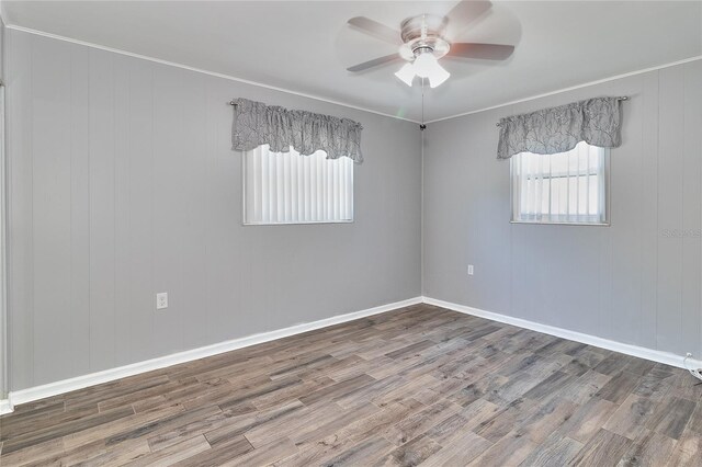 3045 Stratford Dr, Largo, FL 33771 - spare room featuring ceiling fan, baseboards, ornamental molding, and wood finished floors