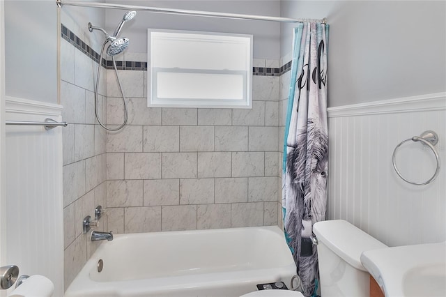 3045 Stratford Dr, Largo, FL 33771 - full bath featuring shower / bath combo, a wainscoted wall, and toilet