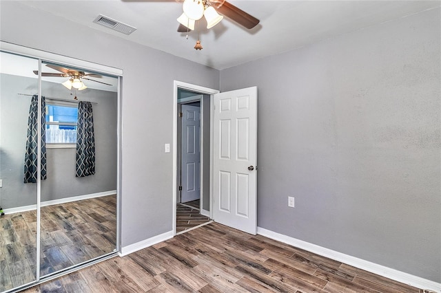 3045 Stratford Dr, Largo, FL 33771 - unfurnished bedroom with baseboards, wood finished floors, visible vents, and a closet