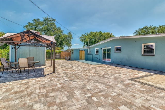 3045 Stratford Dr, Largo, FL 33771 - view of patio with fence, a gazebo, and outdoor dining space