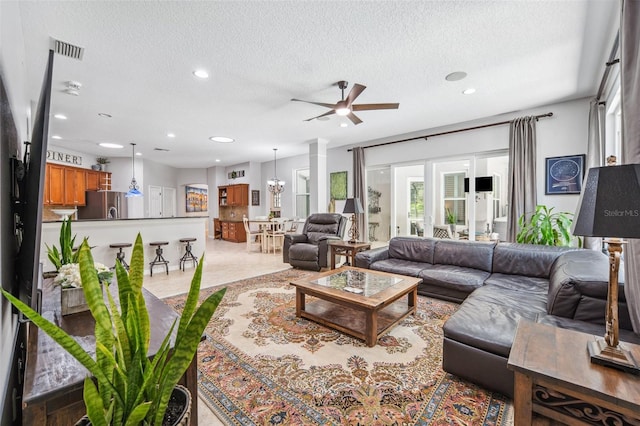 15930 Sorawater Dr, Lithia, FL 33547 - living room with a ceiling fan, recessed lighting, and a textured ceiling