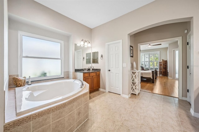 15930 Sorawater Dr, Lithia, FL 33547 - full bathroom with vanity, a bath, baseboards, and tile patterned floors
