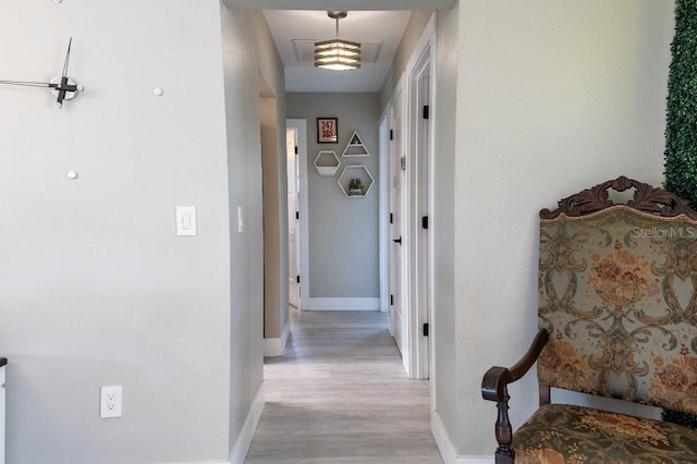 600 Eleuthera Dr, Punta Gorda, FL 33950 - hall featuring light wood-style flooring, baseboards, and visible vents