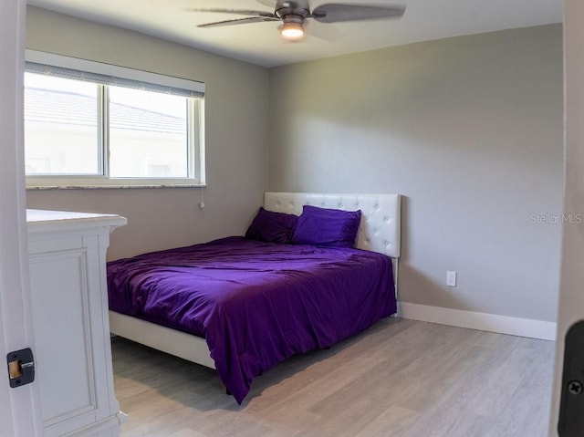 600 Eleuthera Dr, Punta Gorda, FL 33950 - bedroom with ceiling fan, light wood-style floors, and baseboards