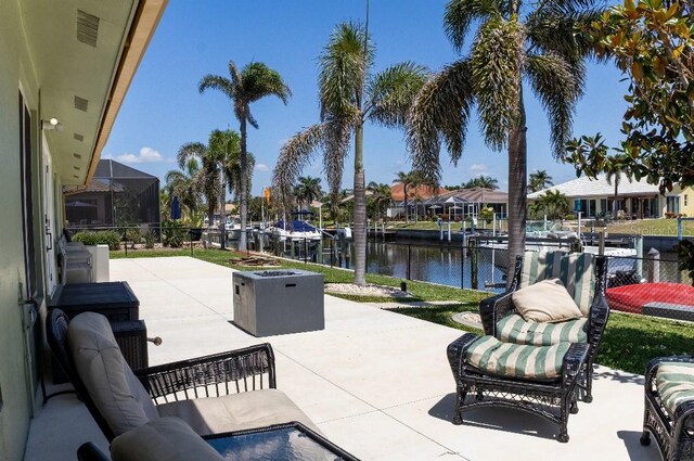 600 Eleuthera Dr, Punta Gorda, FL 33950 - view of patio featuring a water view, visible vents, a lanai, and a dock