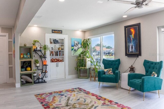 600 Eleuthera Dr, Punta Gorda, FL 33950 - sitting room with wood finished floors, a ceiling fan, built in shelves, and recessed lighting