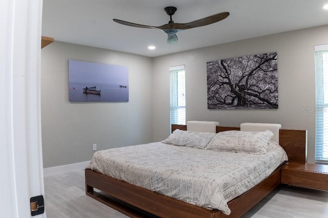 600 Eleuthera Dr, Punta Gorda, FL 33950 - bedroom with recessed lighting, light wood-style floors, multiple windows, and ceiling fan