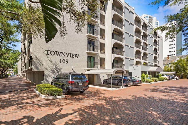 105 4th Ave NE Unit 219, Saint Petersburg, FL 33701 - view of building exterior featuring uncovered parking