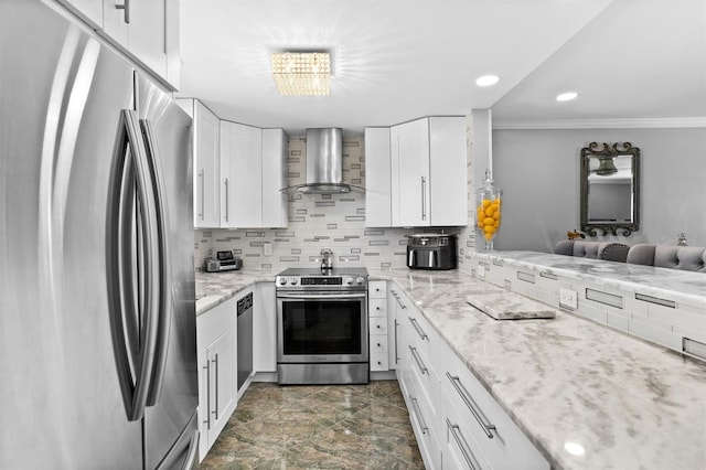 105 4th Ave NE Unit 219, Saint Petersburg, FL 33701 - kitchen featuring white cabinets, wall chimney exhaust hood, stainless steel appliances, tasteful backsplash, and ornamental molding