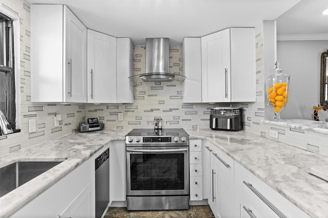 105 4th Ave NE Unit 219, Saint Petersburg, FL 33701 - kitchen featuring decorative backsplash, wall chimney range hood, white cabinets, a sink, and appliances with stainless steel finishes