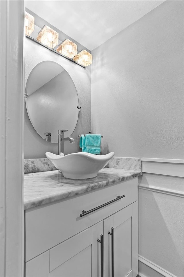 105 4th Ave NE Unit 219, Saint Petersburg, FL 33701 - bathroom featuring a textured wall and vanity