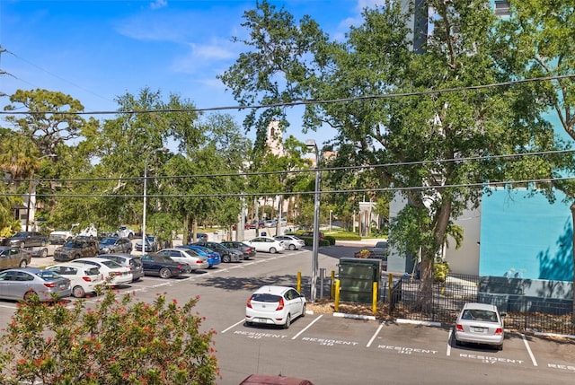 105 4th Ave NE Unit 219, Saint Petersburg, FL 33701 - uncovered parking lot featuring fence