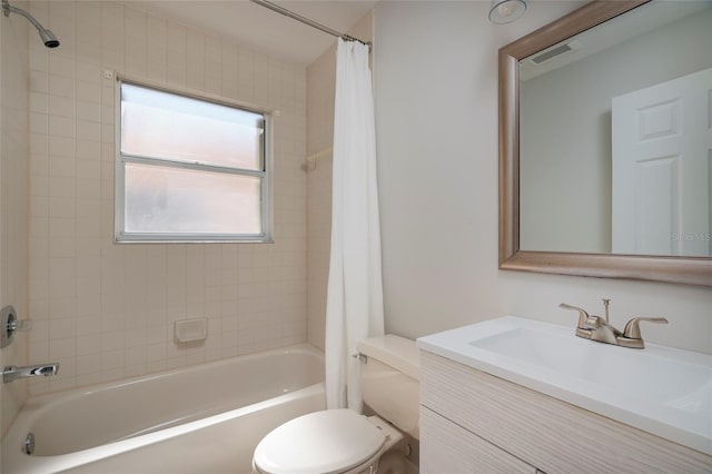 bathroom with toilet, vanity, shower / tub combo with curtain, and visible vents