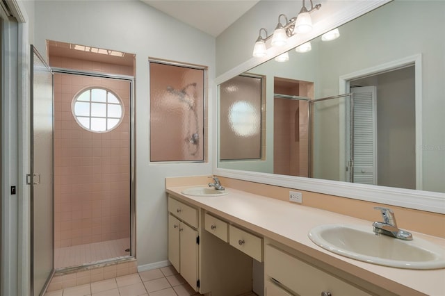 bathroom with a sink and a stall shower