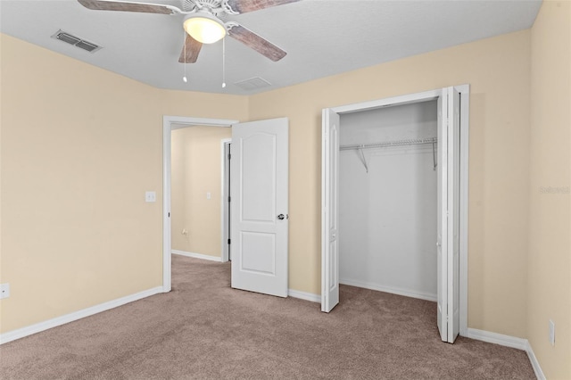 unfurnished bedroom featuring visible vents, baseboards, a closet, a ceiling fan, and carpet flooring