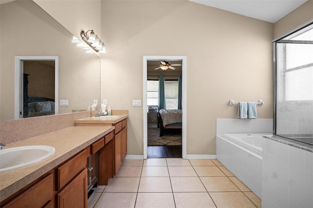 full bathroom with double vanity, a sink, ensuite bath, and plenty of natural light
