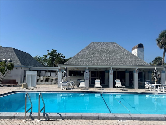 4237 Tamargo Dr Unit 4237, New Port Richey, FL 34652 - community pool with a patio area, fence, and ceiling fan