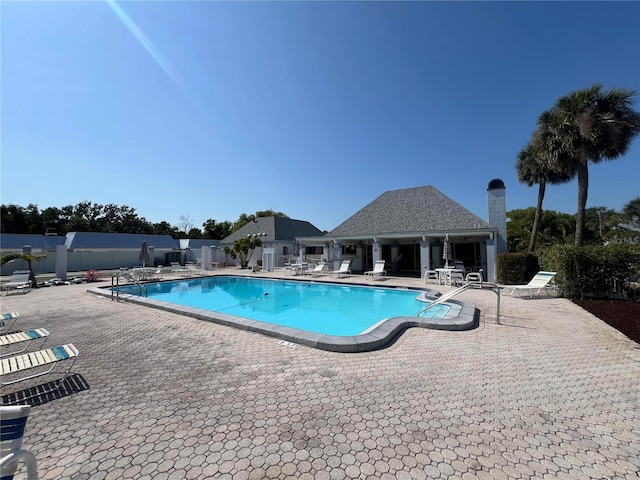 4237 Tamargo Dr Unit 4237, New Port Richey, FL 34652 - community pool featuring a patio and fence