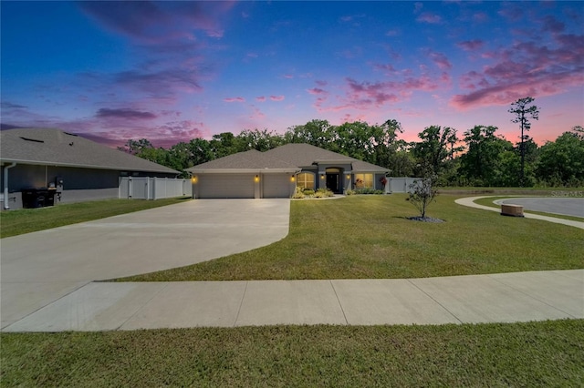 5419 Knights Landing Dr, Lakeland, FL 33810 - ranch-style house featuring fence, a garage, a lawn, and concrete driveway