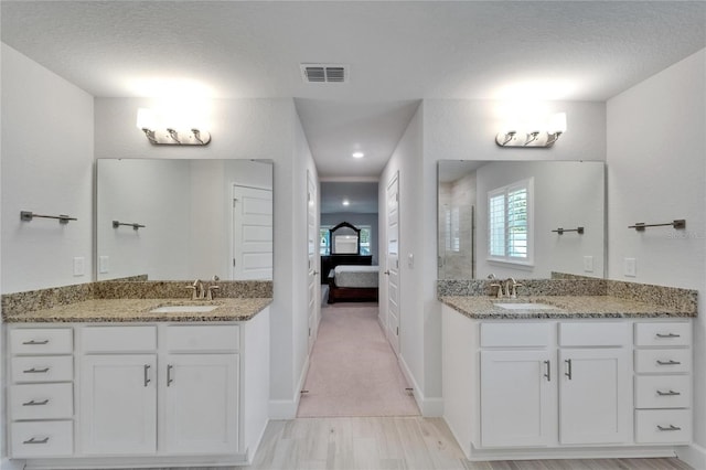 5419 Knights Landing Dr, Lakeland, FL 33810 - ensuite bathroom with a shower stall, a sink, visible vents, and connected bathroom