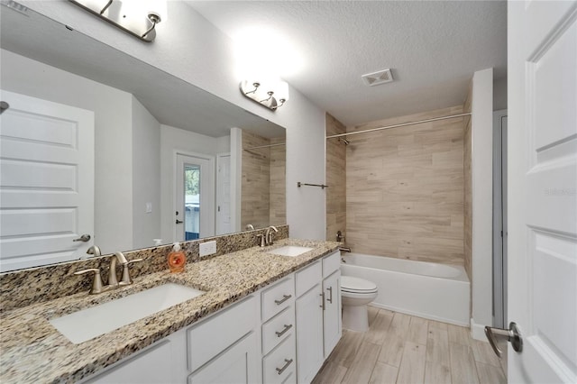 5419 Knights Landing Dr, Lakeland, FL 33810 - full bathroom featuring toilet, double vanity, a sink, and visible vents
